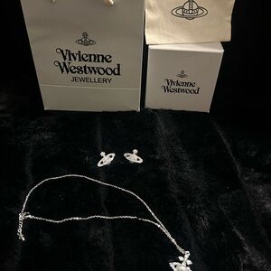 vivienne saturn earrings and vivienne pearl necklace set